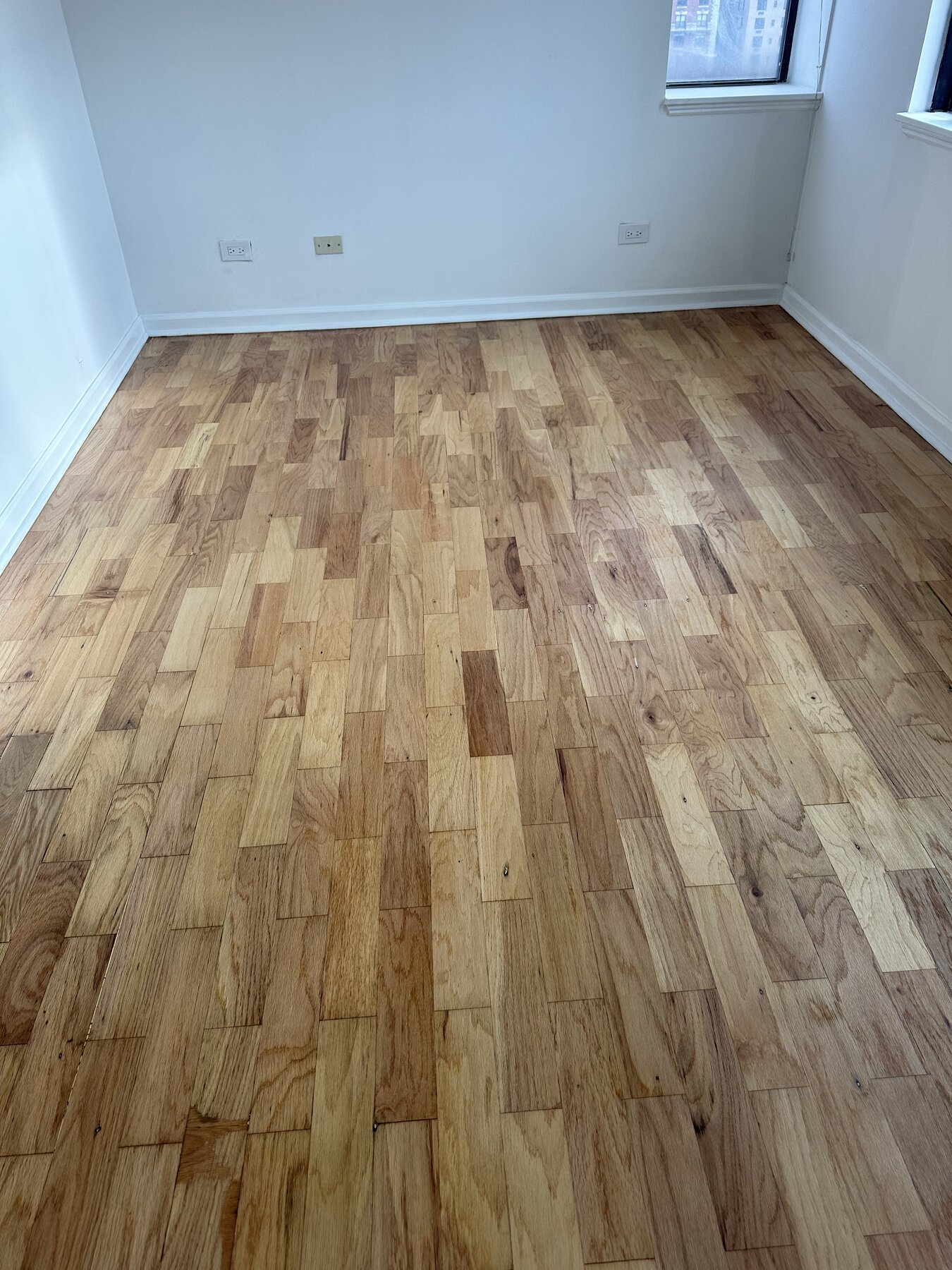 Same hardwood floor after professional refinishing