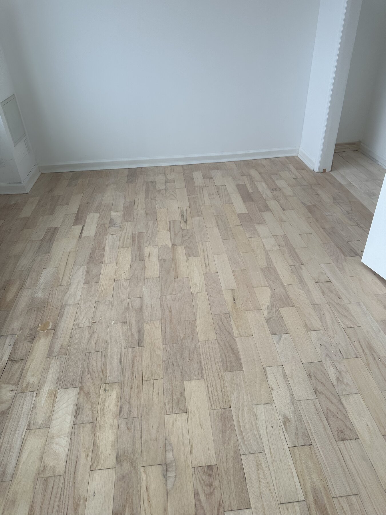 Worn hardwood floor before refinishing
